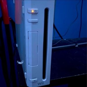 Used Wii with two games, two remotes and a nunchuck. (All wires included)